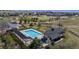 Aerial image featuring a pool and recreation area in a well maintained planned community at 1113 Southbury Pl, Highlands Ranch, CO 80129