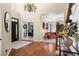 Welcoming entryway with hardwood floors, a high ceiling, and views into the office and living room at 1113 Southbury Pl, Highlands Ranch, CO 80129
