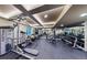 Spacious home gym with mirrored walls and a variety of weight training and fitness equipment at 1113 Southbury Pl, Highlands Ranch, CO 80129
