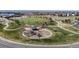 Aerial view of community park including a playground, walking paths, and a soccer field at 1113 Southbury Pl, Highlands Ranch, CO 80129