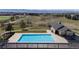 Community pool and lounge area with mountain views and a covered pergola at 1113 Southbury Pl, Highlands Ranch, CO 80129