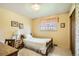 Cozy bedroom with a twin bed, desk, and side table, with natural light from a window at 7245 W 70Th Ave, Arvada, CO 80003