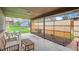 Covered patio with swing, seating, and view of the backyard at 7245 W 70Th Ave, Arvada, CO 80003