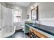 Charming bathroom with a clawfoot tub, unique basin sink, and classic fixtures at 1399 Newton St, Denver, CO 80204