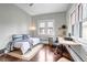 Comfortable bedroom setup with desk area and bright natural light at 1399 Newton St, Denver, CO 80204