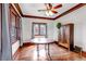 Bright dining room with hardwood floors, wood trim and ceiling fan at 1399 Newton St, Denver, CO 80204