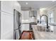 Well-designed kitchen with stainless steel appliances, white cabinets, and a convenient sink area at 1399 Newton St, Denver, CO 80204