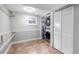 Efficient laundry room with tile floors and shelving, plus modern washer and dryer at 1399 Newton St, Denver, CO 80204