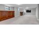 Spacious living room boasts a fireplace, a large built-in cabinet, and bright windows at 1399 Newton St, Denver, CO 80204