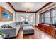 Spacious living room with original woodwork, hardwood floors, and stylish furnishings at 1399 Newton St, Denver, CO 80204