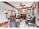 Charming living room with hardwood floors, original woodwork, fireplace and stylish furnishings at 1399 Newton St, Denver, CO 80204