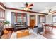 Cozy living room with original woodwork, wood-burning fireplace, and lots of natural light at 1399 Newton St, Denver, CO 80204
