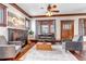 Warm living room with original woodwork, fireplace, and lots of natural light at 1399 Newton St, Denver, CO 80204