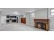 Cozy living room boasts a fireplace, kitchen and a classic built-in cabinet at 1399 Newton St, Denver, CO 80204