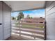 Balcony with wood decking and slatted railing overlooking neighborhood streets at 7665 E Eastman Ave # 302B, Denver, CO 80231