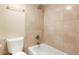 Bathroom with shower over tub and tiled surround at 7665 E Eastman Ave # 302B, Denver, CO 80231