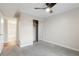 Cozy bedroom with carpet, mirrored closet, and doorway leading to a tiled bathroom at 7665 E Eastman Ave # 302B, Denver, CO 80231