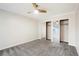 Carpeted bedroom with closet featuring mirrored sliding doors for convenient storage at 7665 E Eastman Ave # 302B, Denver, CO 80231
