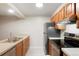 Functional kitchen with stainless steel appliances and tile flooring at 7665 E Eastman Ave # 302B, Denver, CO 80231