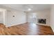 Bright living room featuring wood floors, a fireplace, and sliding doors to the balcony at 7665 E Eastman Ave # 302B, Denver, CO 80231