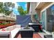 Enjoy the cozy back deck with grill, comfortable seating, and convenient sliding glass door access at 1885 S Quebec Way # G 106, Denver, CO 80231