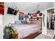 Bedroom with posters, decorations, closet and TV at 1885 S Quebec Way # G 106, Denver, CO 80231