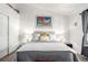 Bedroom with a large gray bed and decor at 1885 S Quebec Way # G 106, Denver, CO 80231