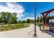 Community bike path with greenery and signage at 1885 S Quebec Way # G 106, Denver, CO 80231