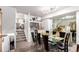 Bright dining room showcasing a glass table, stylish chairs, and modern décor at 1885 S Quebec Way # G 106, Denver, CO 80231