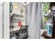 Small home office or study space with a desk, chair, and shelving unit at 1885 S Quebec Way # G 106, Denver, CO 80231