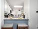 Bright, modern kitchen with white cabinets and a breakfast bar with seating at 1885 S Quebec Way # G 106, Denver, CO 80231