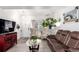 Bright living room with updated flooring, neutral walls, and comfortable seating at 1885 S Quebec Way # G 106, Denver, CO 80231