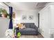 Comfortable room with a sofa, potted plants, and decor at 1885 S Quebec Way # G 106, Denver, CO 80231