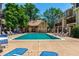 Community pool with lounge chairs and a covered seating area perfect for relaxing on a sunny day at 1885 S Quebec Way # G 106, Denver, CO 80231