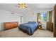 Inviting main bedroom with vaulted ceiling, lots of light, and dresser at 11950 Kearney Cir, Thornton, CO 80233