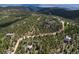 Breathtaking aerial shot of 173 Silver Cloud Ln nestled among towering pines at 173 Silver Cloud Ln, Boulder, CO 80302