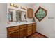 Bathroom featuring wood cabinets, tile flooring, and unique diamond-shaped window at 173 Silver Cloud Ln, Boulder, CO 80302