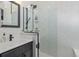 Modern bathroom featuring sleek fixtures, white marble, and walk-in shower at 173 Silver Cloud Ln, Boulder, CO 80302