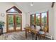 Cozy breakfast nook with wood floors, large windows, and views of the surrounding greenery at 173 Silver Cloud Ln, Boulder, CO 80302