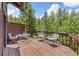 Spacious deck perfect for outdoor entertaining and enjoying the peaceful wooded surroundings at 173 Silver Cloud Ln, Boulder, CO 80302