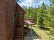 Exterior view of house with a staircase leading to the front door and a view of the outdoor deck at 173 Silver Cloud Ln, Boulder, CO 80302