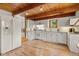 Well-lit kitchen with modern appliances, ample cabinet space, and wood flooring at 173 Silver Cloud Ln, Boulder, CO 80302