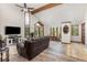 Bright living room features a vaulted ceiling, exposed wood beams, and wood-burning fireplace at 173 Silver Cloud Ln, Boulder, CO 80302