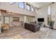 Bright living room features high ceilings, unique windows, wood floors, and comfortable seating at 173 Silver Cloud Ln, Boulder, CO 80302