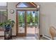 French doors leading to a private deck overlooking the serene forest at 173 Silver Cloud Ln, Boulder, CO 80302