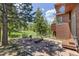 Outdoor patio space with wooded views and seating area at 173 Silver Cloud Ln, Boulder, CO 80302