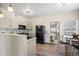 Bright kitchen with a dining area, stainless steel appliances, and ample counter space at 8435 Pebble Creek Way # 104, Highlands Ranch, CO 80126