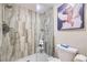 A modern bathroom with a glass-enclosed shower featuring stylish tile and a sleek design at 4250 S Olive St # 102, Denver, CO 80237