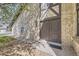 Front entrance with a brown double-door design and well maintained brick exterior at 4250 S Olive St # 102, Denver, CO 80237