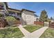 Exterior of building with brick and lush green lawns at 4250 S Olive St # 102, Denver, CO 80237